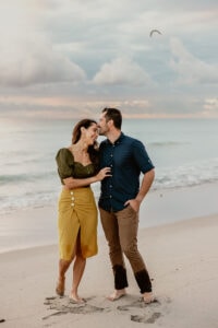 couple beach sunrise kissing