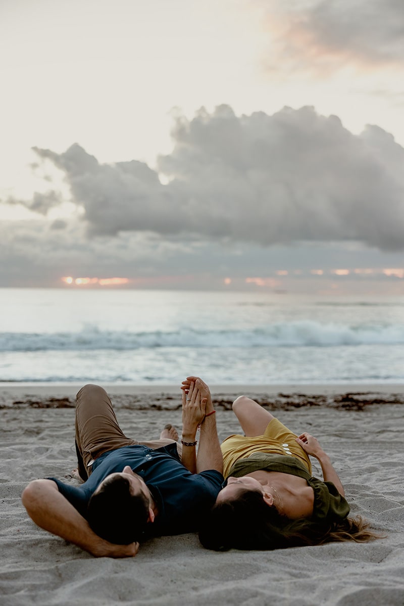 couple laying down beach