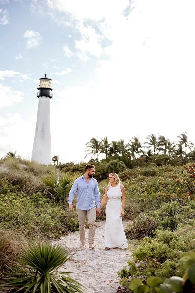 lighthouse, beach, walking, couple, white dress