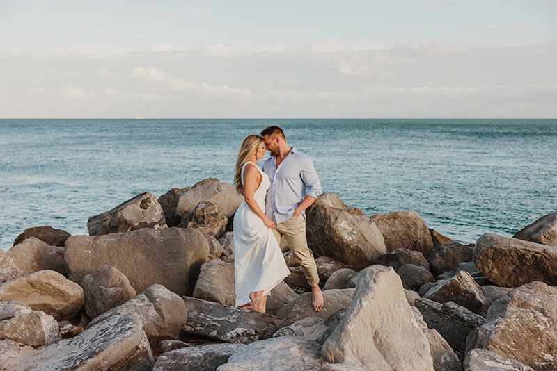 couple, rocks, beach, sunset, white dress