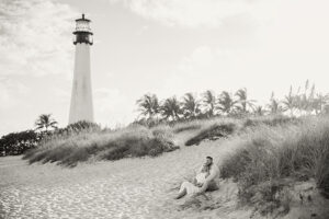 lighthouse, sand, beach, birds, couple, sitting down
