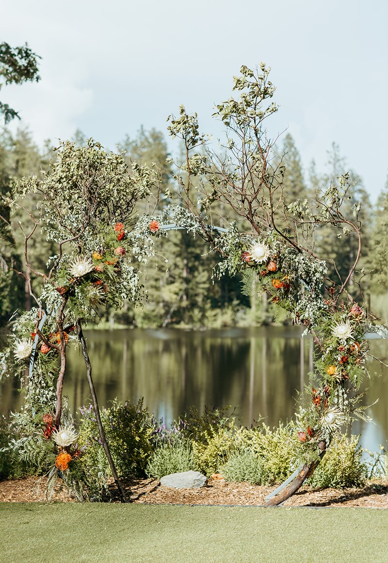 lord of the rings inspired wedding, wedding arch, wedding flowers, greenery